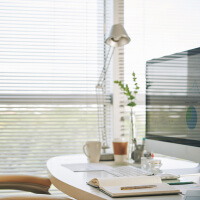 A person stretching their neck and shoulders to improve blood flow to the brain for mental clarity